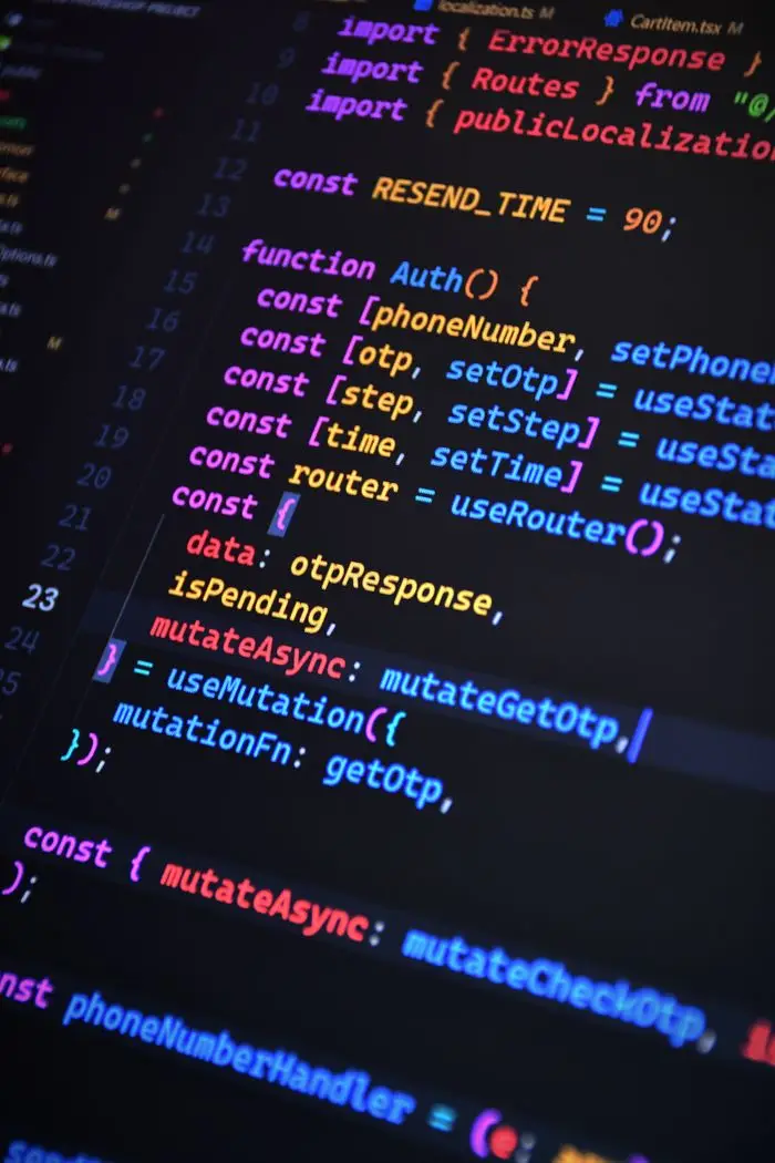 Close-up of vibrant JavaScript code for web development with ReactJS and Tailwind CSS.